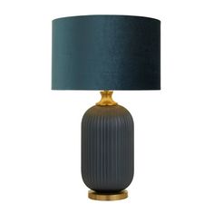 a black and gold lamp with a blue shade