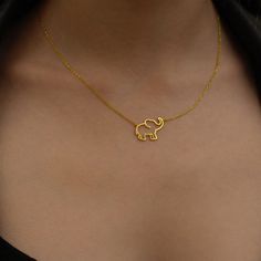 "Choose this beautiful elephant necklace for a cute reminder of mindful moments. Created by hand this gorgeous gold elephant necklace makes a perfect gift for the person who brings you joy. Wear this wealthy symbol necklace close to your heart to share with others how much you deeply care about their well being.  * Material: 14K Solid Gold (real solid gold, no gold-filled or no gold plated material), 925 Sterling Silver  * Choice of Gold Color: Yellow Gold, Rose Gold, White Gold  * Closure: Spring ring  * Chain style: Cable  * Style: Minimalist Thinking of gifting? Elevate your order with our Christmas Gift Wrap option! 🎁 Buy from here! https://www.etsy.com/listing/1580219719/ M O R E F R O M U S Mionza Jewels' pieces are handcrafted by 30 years of experienced craftsmen and made to order. Elephant Jewelry Necklace, Location Names, African Necklaces, Gold Elephant Pendant, Elephant Necklace Gold, Beautiful Elephant, Mindful Moments, Elephant Jewelry, Gold Elephant