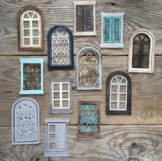 many different types of windows and doors on a wooden surface