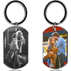 two key chains with an image of a man and woman holding a teddy bear on them