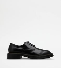 Lace-ups in elegant semi-shiny leather, with stamped Tod's monogram and extralight rubber outsole. Featuring the distinctive rubber pebbles on the tread, they are finished with a leather welt. Tod's Shoes, Man Black, Black Man, Monogrammed Leather, Logo Color, Leather And Lace, Leather Men, Black Men, Black Lace