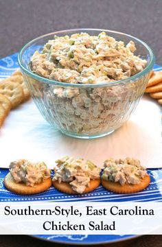 chicken salad with crackers in the middle on a blue and white plate next to it