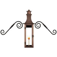 an old fashioned lantern with a candle on the top and wrought iron work around it