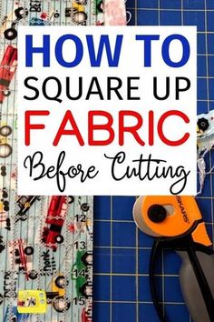 a pair of scissors sitting on top of fabric next to a cutting board with the words how to square up fabric before cutting