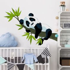 a baby's room with panda bear wall decals