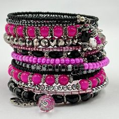 This Lovely Hot Pink And Black Coil Bracelet Is Made On 13 Rows Of Silver Memory Wire With Various Glass Beads, Hematite, Metal Spacers, Endless Amounts Of Crystals, Then Finished Off With Handmade Crystal Drops At Both Ends And A Unicorn Charm. Stretch Beaded Bracelets Diy, Unicorn Charm, Coil Bracelet, Black Beaded Bracelets, Black Bracelets, Memory Wire, Beaded Bracelets Diy, Crystal Drop, Diy Bracelets