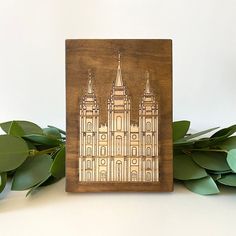 a wooden block with an image of a cathedral on it