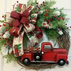 a wreath with a red truck on it