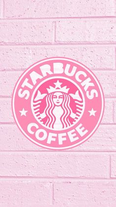 the starbucks logo is painted on a pink brick wall