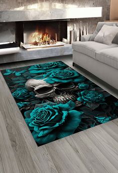 a living room area rug with blue roses on it and a fireplace in the background