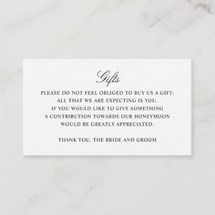 a white card with the words, please do not feel engaged to buy a gift