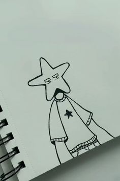 a drawing of a person with a star on their head is shown next to a spiral notebook