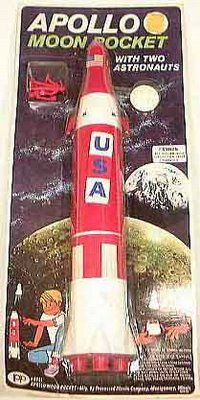 a toy rocket with two astronauts on it's back and an advertisement for the space shuttle