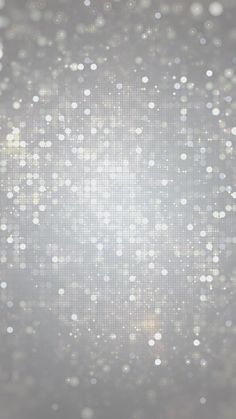 an abstract background with white and silver dots on the left side, in front of a gray backdrop