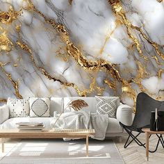 a living room with white and gold marble wallpaper