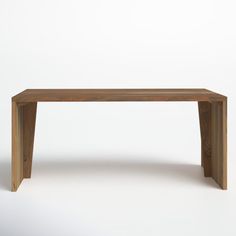 a wooden table sitting on top of a white floor