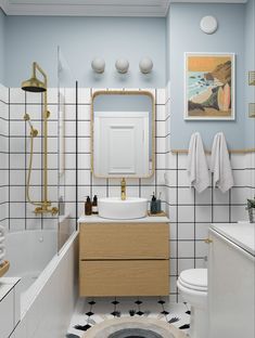 a bathroom with blue walls and white tile on the floor, along with a wooden vanity