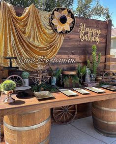 a wooden table topped with lots of wine barrels