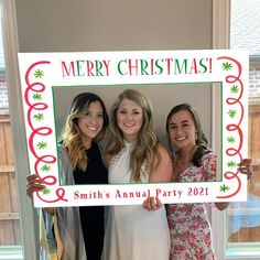 three women are holding up a merry christmas sign with the words smith's annual party written on it