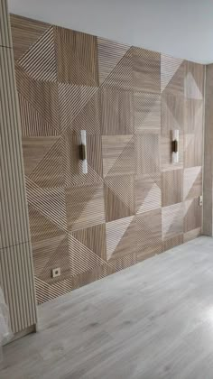 an empty room with wood paneling on the wall