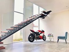 a motorcycle parked in front of a stair case