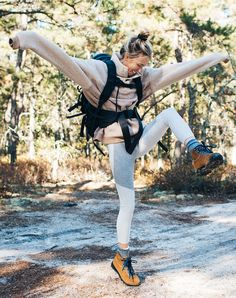 a woman in tights is doing a trick