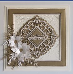 a close up of a greeting card with flowers and snowflakes on the front