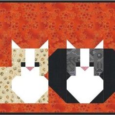 two cats sitting next to each other on top of a red background with white flowers