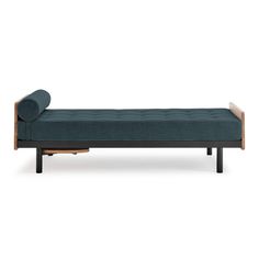 a blue couch sitting on top of a wooden frame