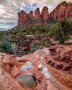 a small pool in the middle of some rocks