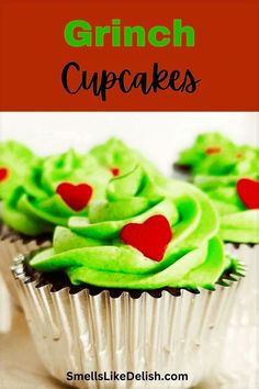 cupcakes with green frosting and red hearts on them are shown in front of the