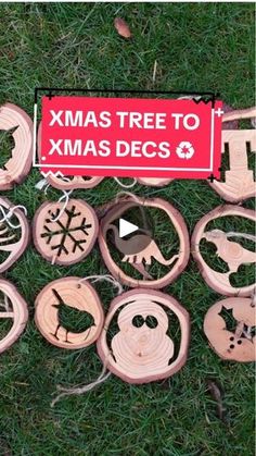 wooden christmas ornaments on the grass with a sign that says xmas tree to xmas decals