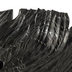 a close up view of some black wood