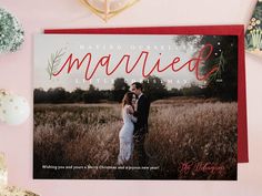 a wedding card with the words married and an image of a couple in a field