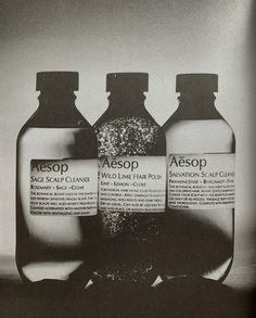 three bottles of aesop sitting next to each other