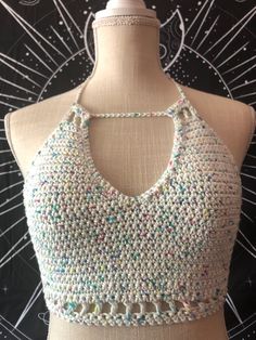 🖤CUSTOM ORDERS WELCOME🖤 100% cotton crochet top. Hand wash or machine wash on delicate. I also recommend using a garment bag. Lay flat to dry. US size small. Approximately 10 inches tall and 18.5 inches wide with tie in the back.  Measurements are taken flat (not stretched). Pattern by Mermaid Cat White Cotton Halter Neck Top, Spring Halter Neck Top With Crochet Trim, Summer Cotton Tops With Crochet Lace, Summer Cotton Tops With Crochet Trim, Summer Cotton Top With Crochet Trim, White Crochet Lace Halter Top For Spring, Bohemian Cotton Crochet Halter Neck Top, Fitted White Crochet Tops, Cotton Crochet Lace Tops For Festival