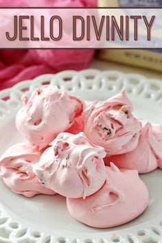 pink meringue on a white plate next to some yarn and a box of knitting needles