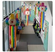 the hallway is decorated with colorful decorations and teddy bears hanging from the ceiling, along with other toys