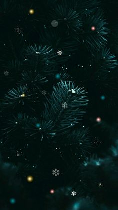 a christmas tree with snowflakes and stars in the night sky, as seen from above