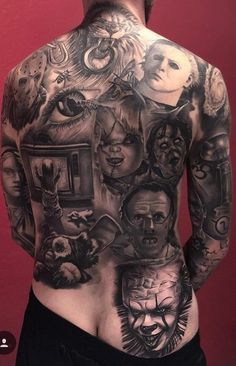 the back of a man's body with many different tattoos on his upper half