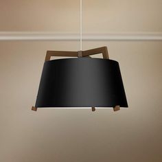 a black lamp hanging from a ceiling in a room