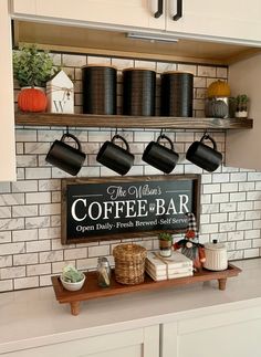 a coffee bar with pots and pans hanging on the wall