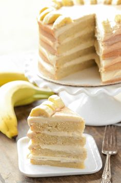 a piece of cake on a plate with bananas