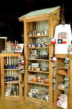 an assortment of items displayed on wooden shelves