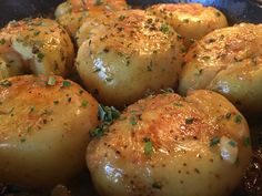 some food is cooking in a skillet on the stove and ready to be eaten