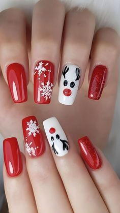 red and white christmas nail art with reindeer, snowflakes and santa's face