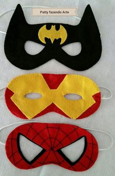 three masks with different designs on them, one has a batman mask and the other has a