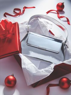 Glam up her holiday look with this dazzling mirrored silver baguette bag! ✨ A stylish and practical gift she'll adore. 🎁 Baguette Bag, Silver Lining, Holiday Looks, Silver Mirrors, Girls Bags, Practical Gifts, Silver