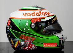 a helmet with the name vodafon on it is sitting on a table