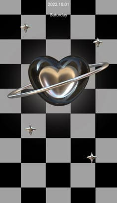 a heart shaped object on top of a checkerboard floor with stars around it